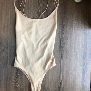 BRAND NEW NUDE BODY SUIT CROSSBACK